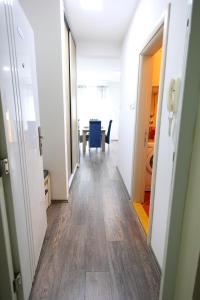 a hallway of an office with a table and chairs at SokoBlue in Soko Banja