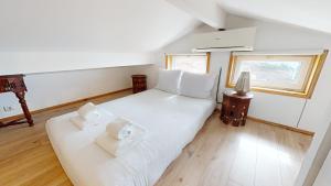 Posteľ alebo postele v izbe v ubytovaní A l'Agachon - Jolie petite maison au bord de l'eau