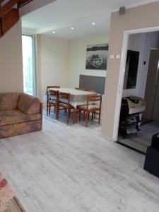 a living room with a couch and a table at All-Inn K&ouml;re in Kisk&ouml;re