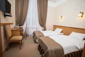 Postel nebo postele na pokoji v ubytování Hotel Litera