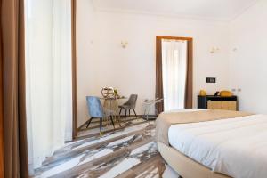 Postel nebo postele na pokoji v ubytování Sant'Antonino Luxury Suite