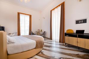 TV a/nebo společenská místnost v ubytování Sant'Antonino Luxury Suite