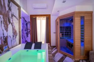 a bathroom with a tub and a large window at Sant'Antonino Luxury Suite in Sorrento