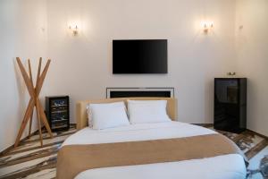 Postel nebo postele na pokoji v ubytování Sant'Antonino Luxury Suite