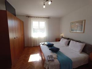 Postel nebo postele na pokoji v ubytování Rooms Rita