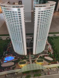 two tall buildings with a model of a city at Residence 5 etoiles Orya Park avec piscine in Istanbul