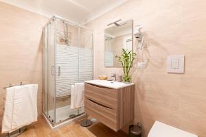 a bathroom with a sink and a shower at Neocore in Naples