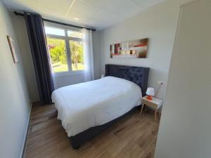 Ένα ή περισσότερα κρεβάτια σε δωμάτιο στο B75 Apartments Bilbao