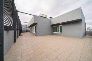 a house with a large patio in front of it at MU Hotel Sasang in Busan