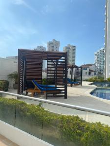 two benches sitting on the roof of a building at El Rodadero Sur SANTA MARTA in Puerto de Gaira