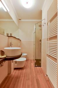 a bathroom with a sink and a shower at Albergo San Martino in Lucca