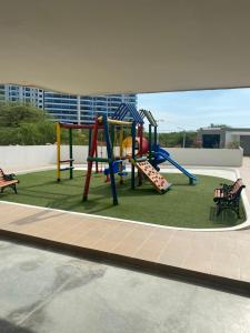 a playground with a slide on a roof at El Rodadero Sur SANTA MARTA in Puerto de Gaira
