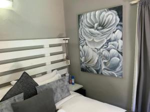 Postel nebo postele na pokoji v ubytování Meraki Upmarket Guesthouse