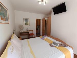 Postel nebo postele na pokoji v ubytování Rooms Rita