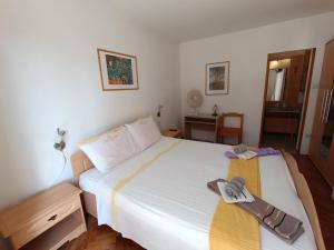 Postel nebo postele na pokoji v ubytování Rooms Rita