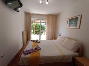 Postel nebo postele na pokoji v ubytování Rooms Rita