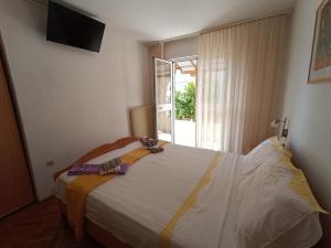 Postel nebo postele na pokoji v ubytování Rooms Rita