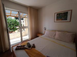Postel nebo postele na pokoji v ubytování Rooms Rita