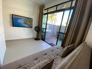 TV a/nebo společenská místnost v ubytování AP TÉRREO COM PISCINA PRIVATIVA