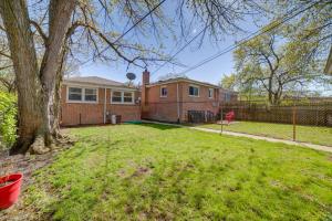 a brick house with a tree in the yard at Chicago Escape Near Navy Pier and Shedd Aquarium! in Chicago