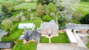 an aerial view of a house with a yard at Large House On Farm With Own Heated Pool, As Seen On BBC TV in Cullompton