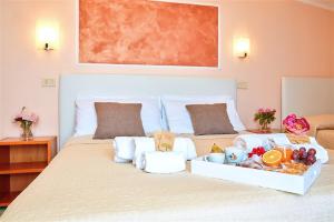 Letto o letti in una camera di Hotel La Pergola