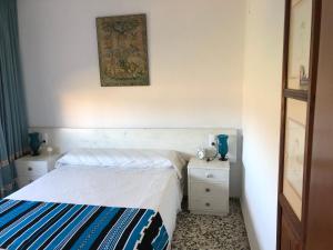 Postel nebo postele na pokoji v ubytování Villa Aeroclub REF. 002