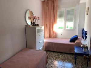 Postel nebo postele na pokoji v ubytování Villa Aeroclub REF. 002
