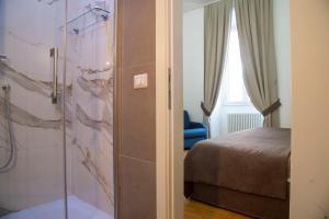 Postel nebo postele na pokoji v ubytování Rome Armony Suites