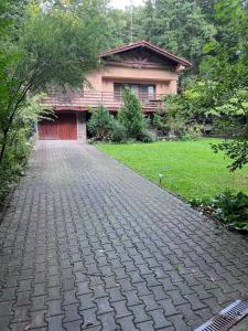 a brick driveway in front of a house at Villa Romana in Pezinok