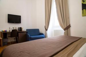 TV a/nebo společenská místnost v ubytování Rome Armony Suites