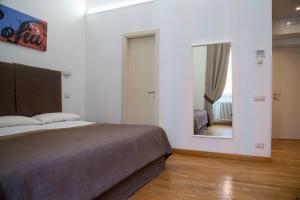 Postel nebo postele na pokoji v ubytování Rome Armony Suites