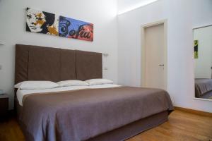 Postel nebo postele na pokoji v ubytování Rome Armony Suites