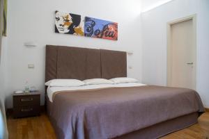 Postel nebo postele na pokoji v ubytování Rome Armony Suites