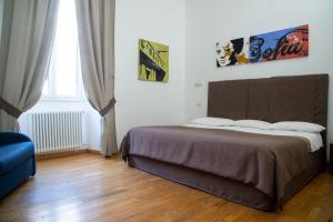 Postel nebo postele na pokoji v ubytování Rome Armony Suites