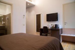 Postel nebo postele na pokoji v ubytování Rome Armony Suites