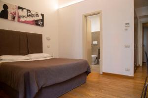 Postel nebo postele na pokoji v ubytování Rome Armony Suites