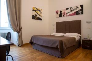 Postel nebo postele na pokoji v ubytování Rome Armony Suites