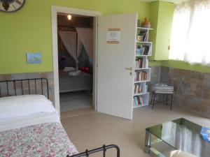 Postel nebo postele na pokoji v ubytování Casale Grandangolo