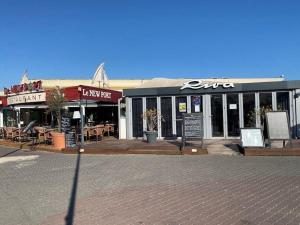 Reštaurácia alebo iné gastronomické zariadenie v ubytovaní Bel Appartement en front de mer -Palavas les Flots