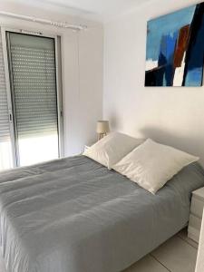 Posteľ alebo postele v izbe v ubytovaní Bel Appartement en front de mer -Palavas les Flots