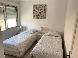 Posteľ alebo postele v izbe v ubytovaní Bel Appartement en front de mer -Palavas les Flots