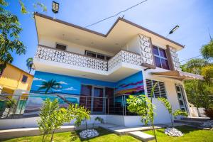 a villa with a view of the ocean at Chris Guest House in Rincon