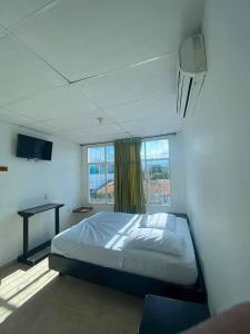 Postel nebo postele na pokoji v ubytování Hotel rubiales