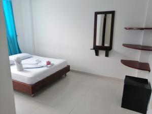 Postel nebo postele na pokoji v ubytování Hotel rubiales + 6 fotografií