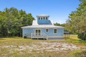 a blue house with a tower on top of it at 30A Pet Friendly Beach House - Vitamin Sea by Panhandle Getaways in Santa Rosa Beach