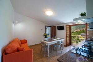 a living room with a couch and a table at I colori della Luna in Agerola