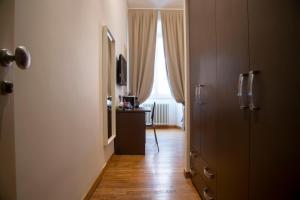 Postel nebo postele na pokoji v ubytování Rome Armony Suites