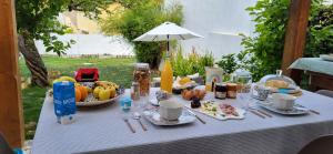 a picnic table with a basket of food on it at Caparica Villa in Almada