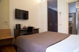 Postel nebo postele na pokoji v ubytování Rome Armony Suites